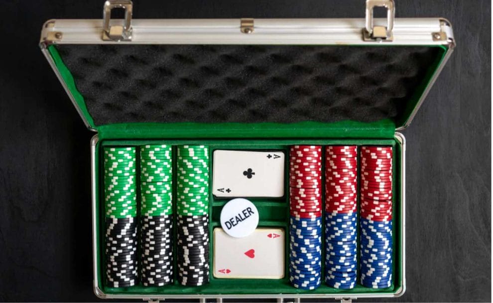 Top view of an aluminum suitcase containing a poker set.
