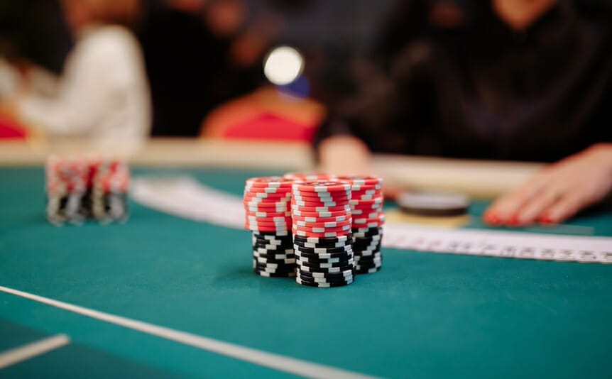 A stack of poker chips on a poker table.