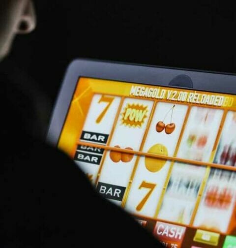 An online slot game on a laptop.