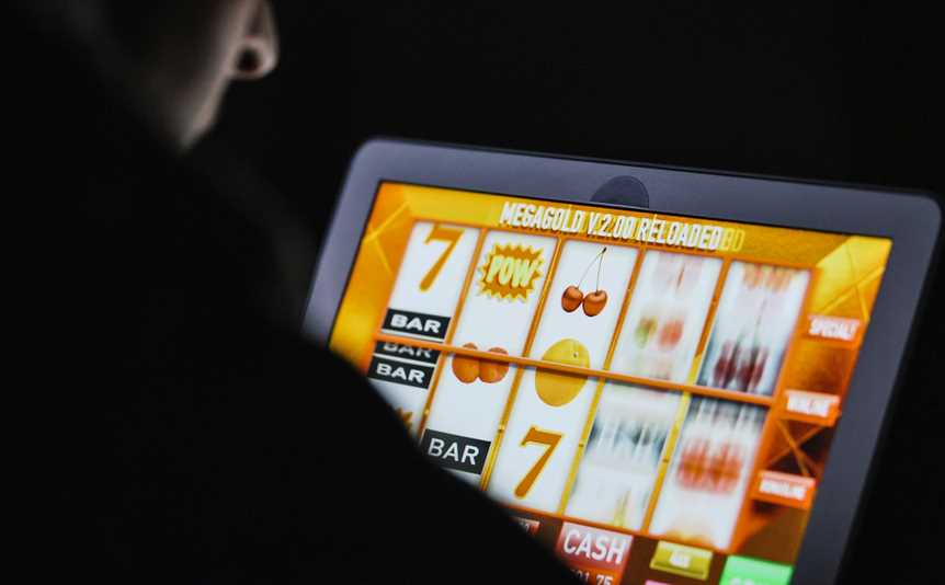 An online slot game on a laptop.