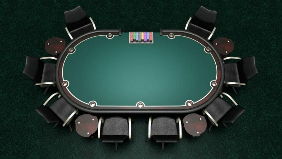 An overhead view of a poker table with empty seats.