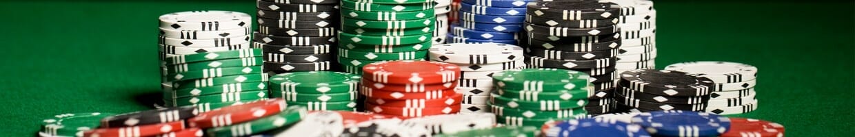 A stack of poker chips on a poker table.