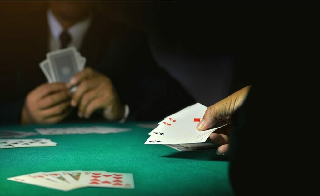 A player showing four aces.