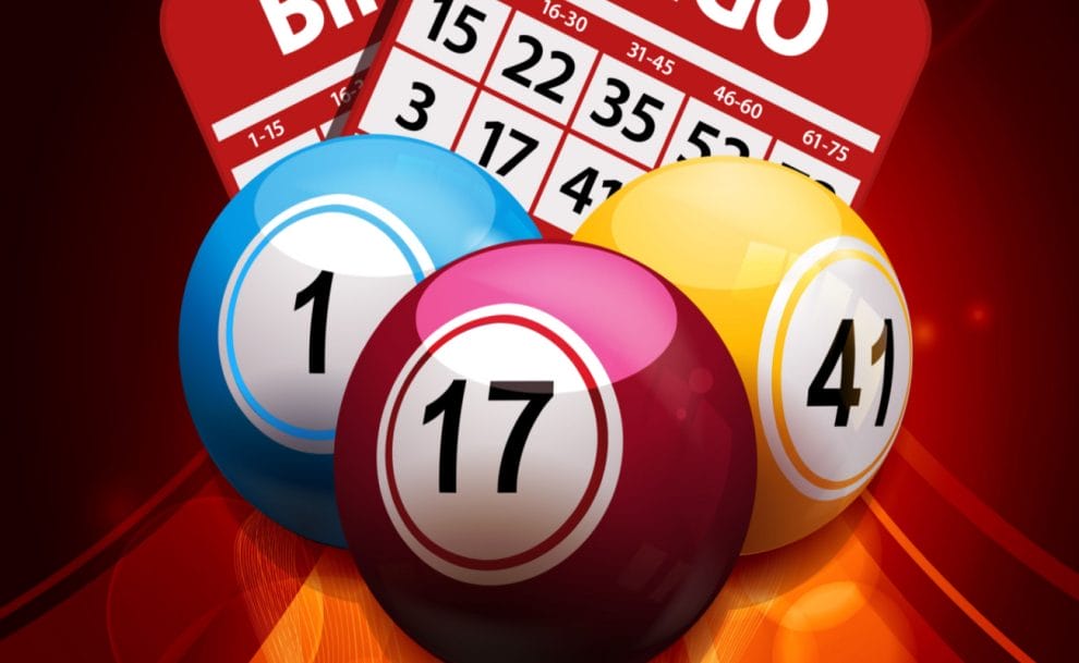 red bingo card and balls against a dark red background.