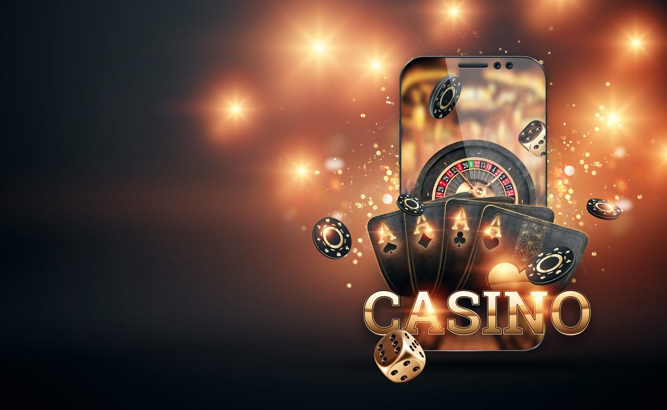 A smartphone with casino games and chips around it and the word “casino” at the bottom of the screen.