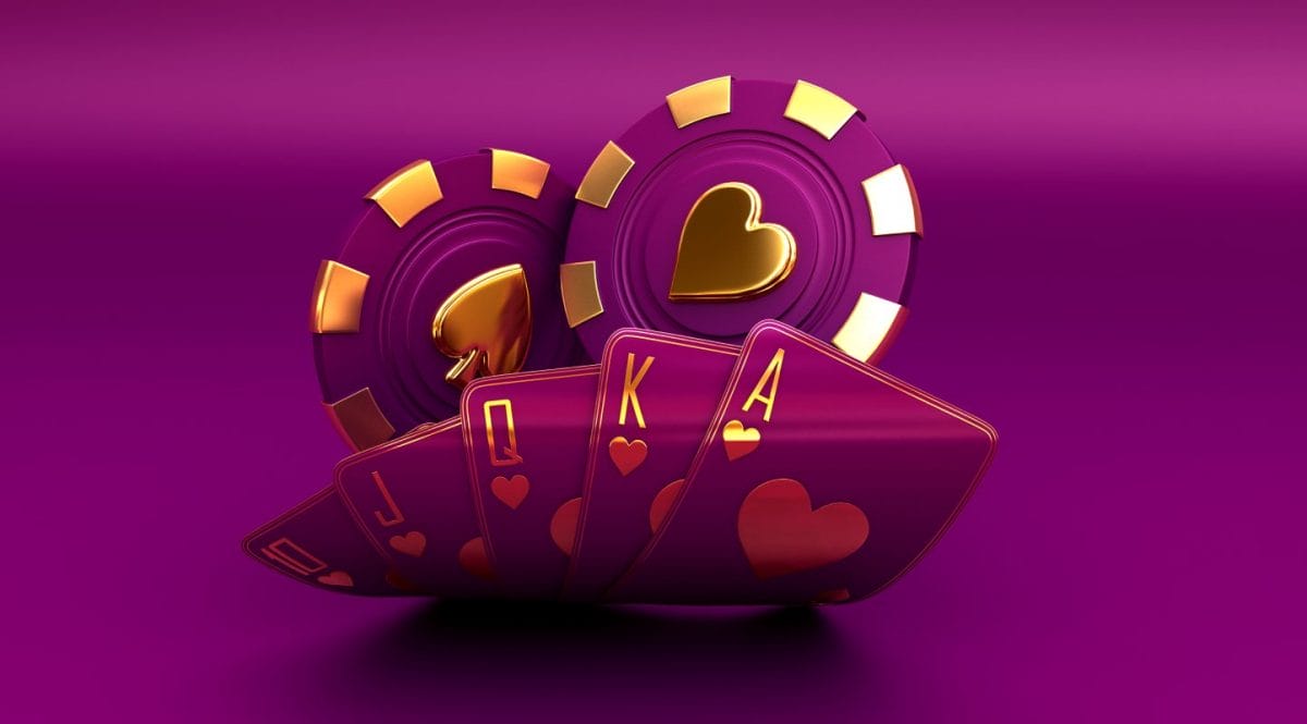 Casino chips and playing cards against a purple background.