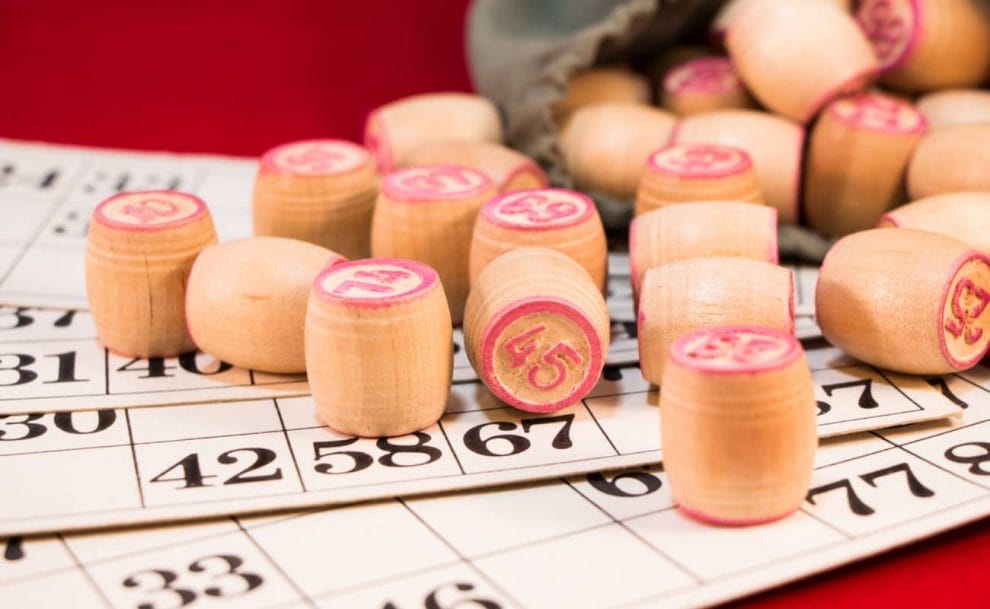 Bingo numbers and bingo cards on a table. 