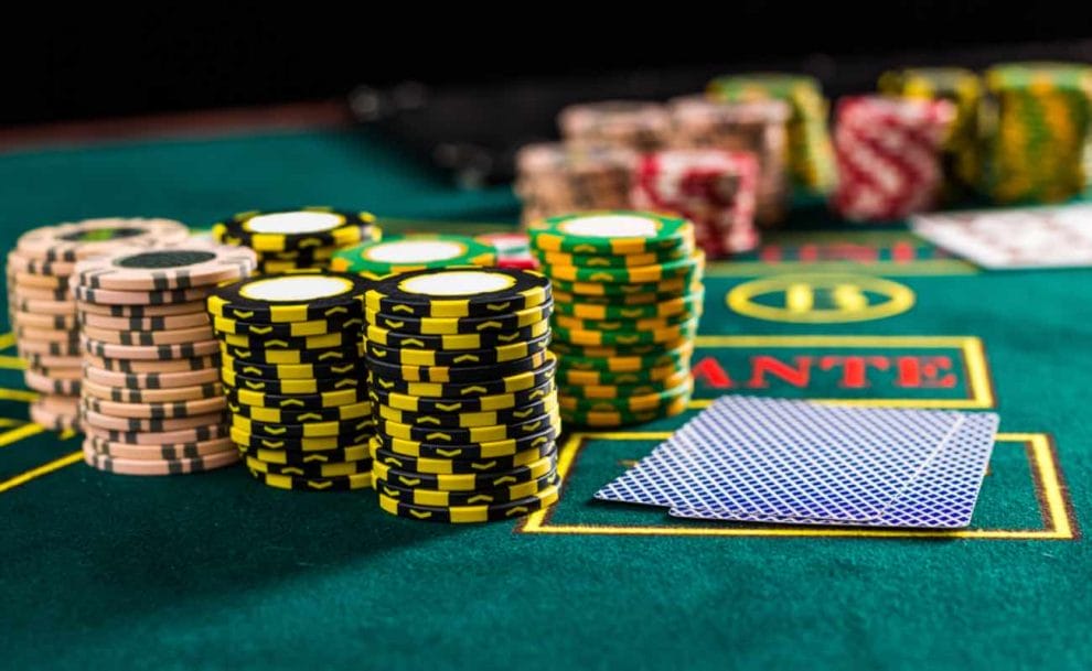 Poker chips and cards on a poker table.