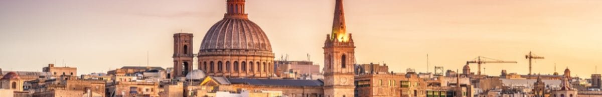 Skyline from Marsans Harbour at sunset in Valletta, Malta.
