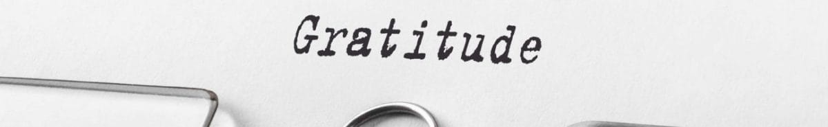 “Gratitude” written on a typewriter page.
