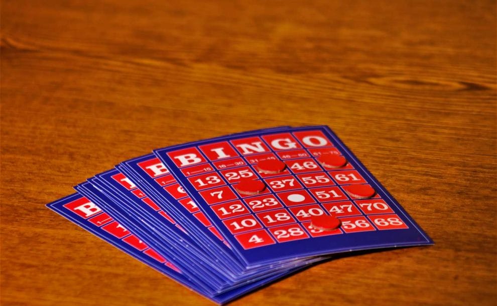 Bingo cards on a wooden table.
