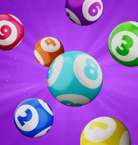 Colorful 3D bingo balls against a bright purple background.