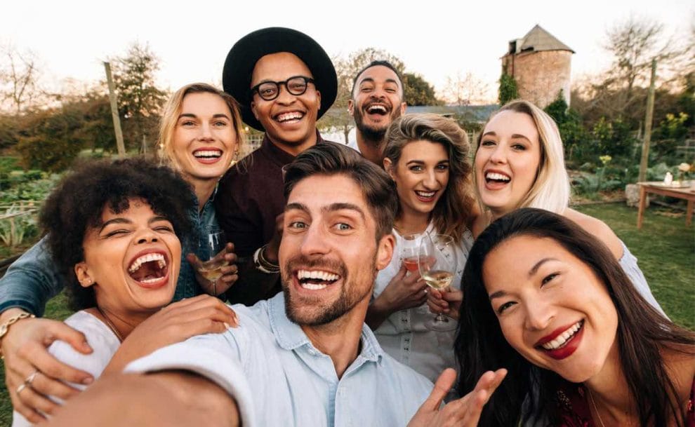  A group of friends taking a selfie at a gathering.