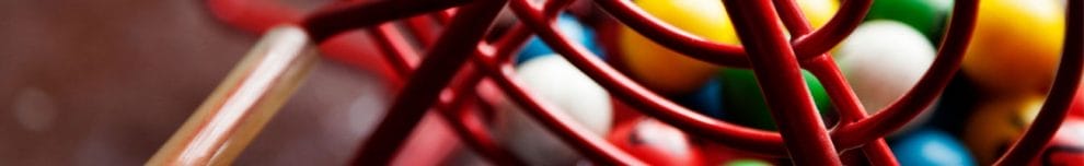 Colorful bingo balls in a bingo cage.