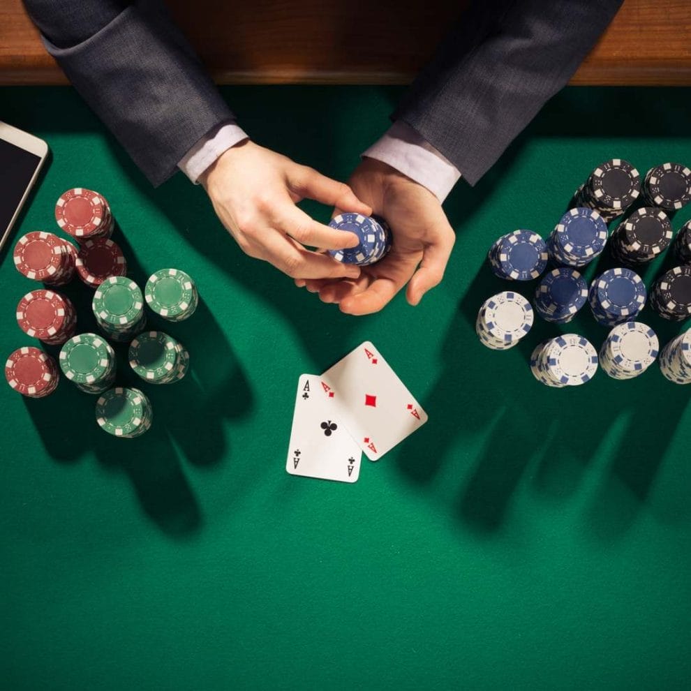 A poker player counts his poker chips.