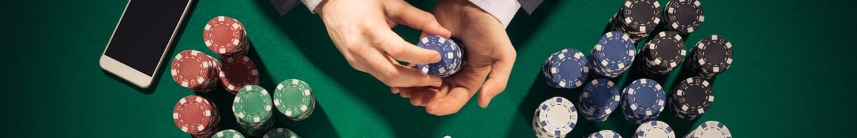 A poker player counts his poker chips.