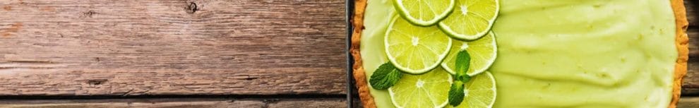 Top view of a Key lime pie on a rustic farmhouse table.
