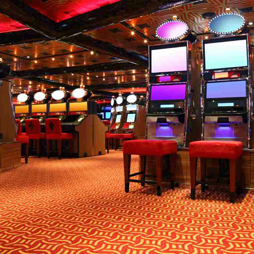 A modern casino floor with slot machines.
