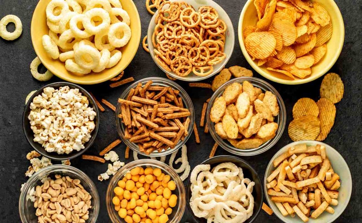 An array of different snack foods on a table.
