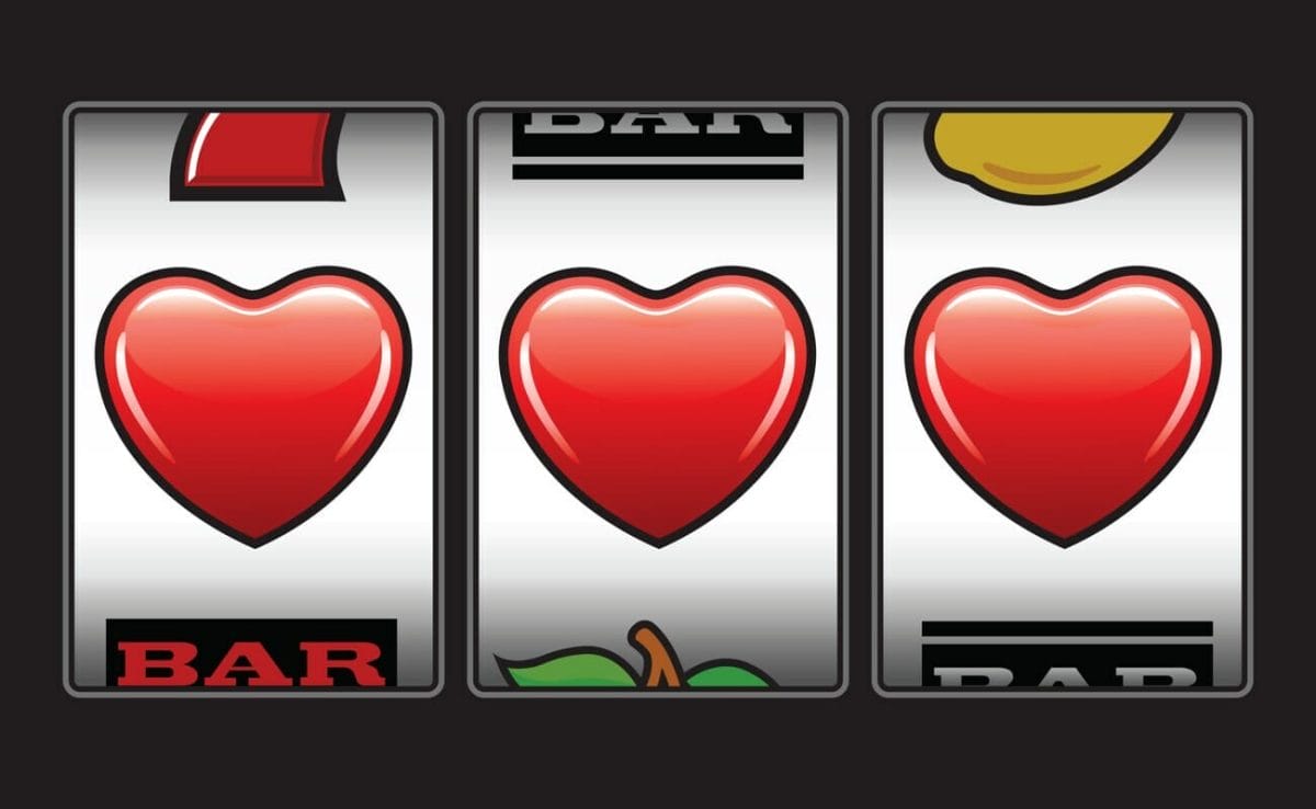 A slot reel with three hearts.