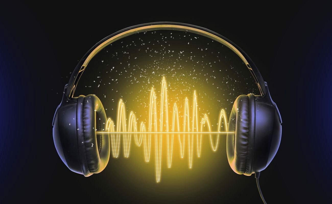 3d rendering of soundwaves between a set of headphones.