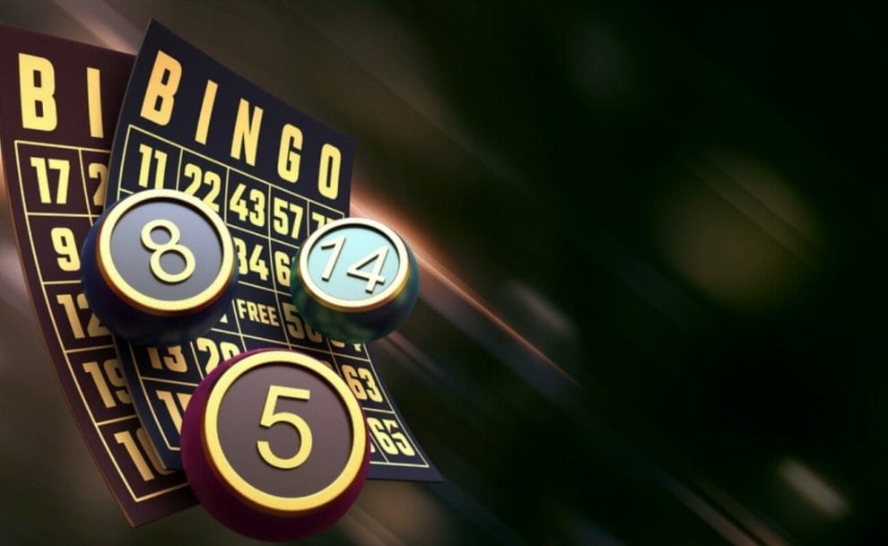 Bingo balls and cards on a dark background. 