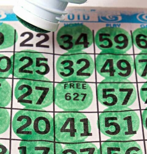 A bingo card with a green bingo dauber.