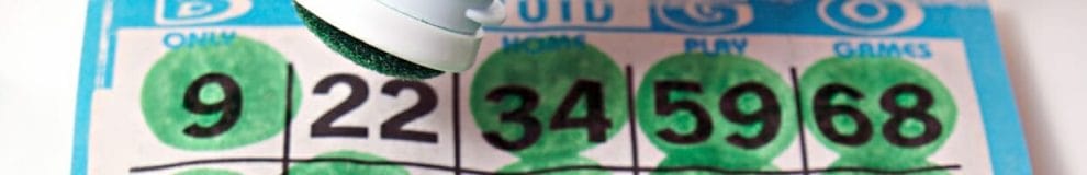 A bingo card with a green bingo dauber.