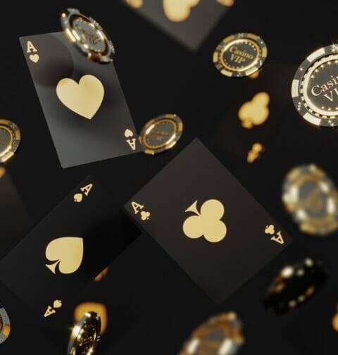 Black and gold poker cards and poker chips falling.