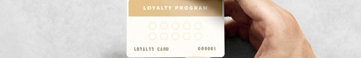A person holds a loyalty card.