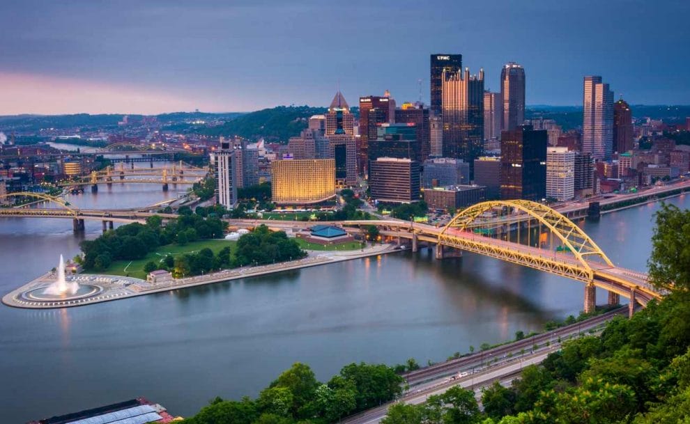 A view of the city of Pittsburgh from across the river at night. 