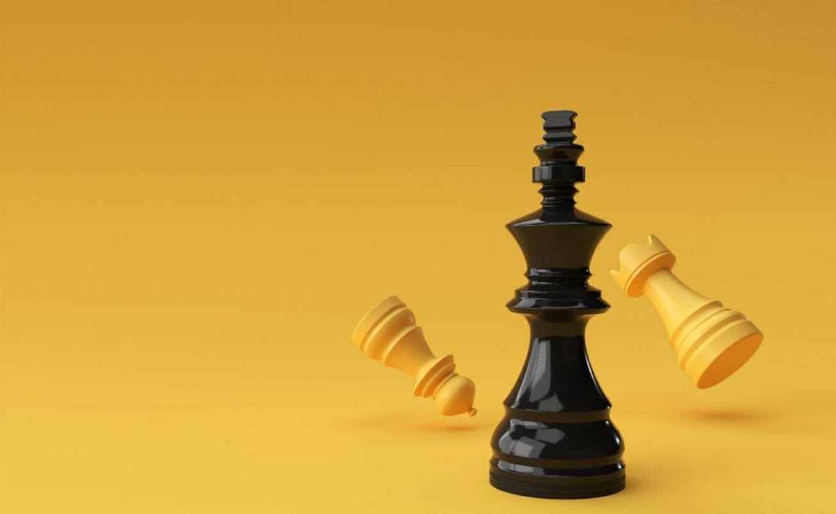  Chess pieces against a bright yellow background.