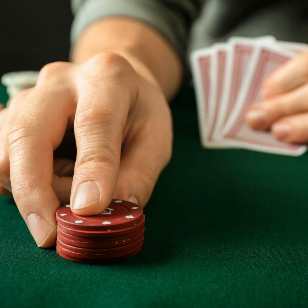 A poker player places a wager.