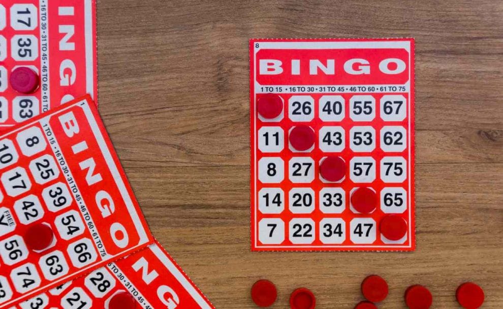 Bingo cards on a wooden table.