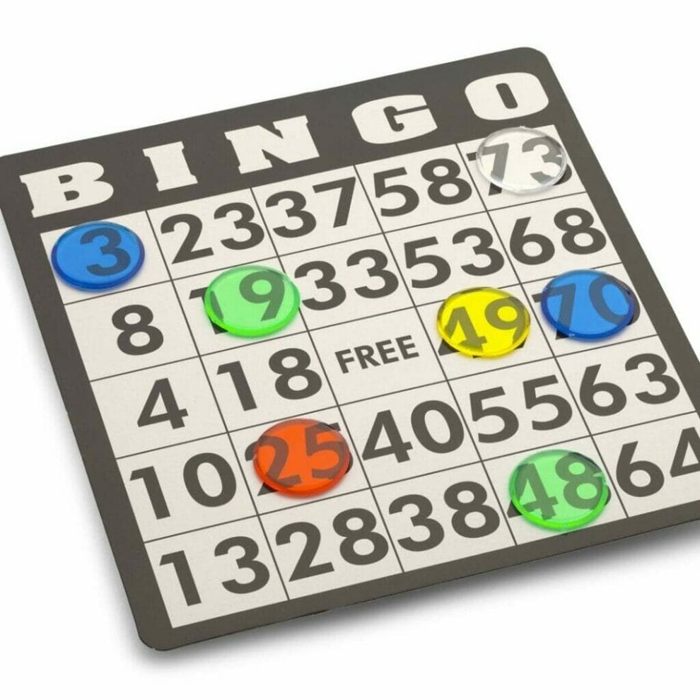A close-up of a bingo card. The numbers 19, 49 and 70 are covered by bingo markers.