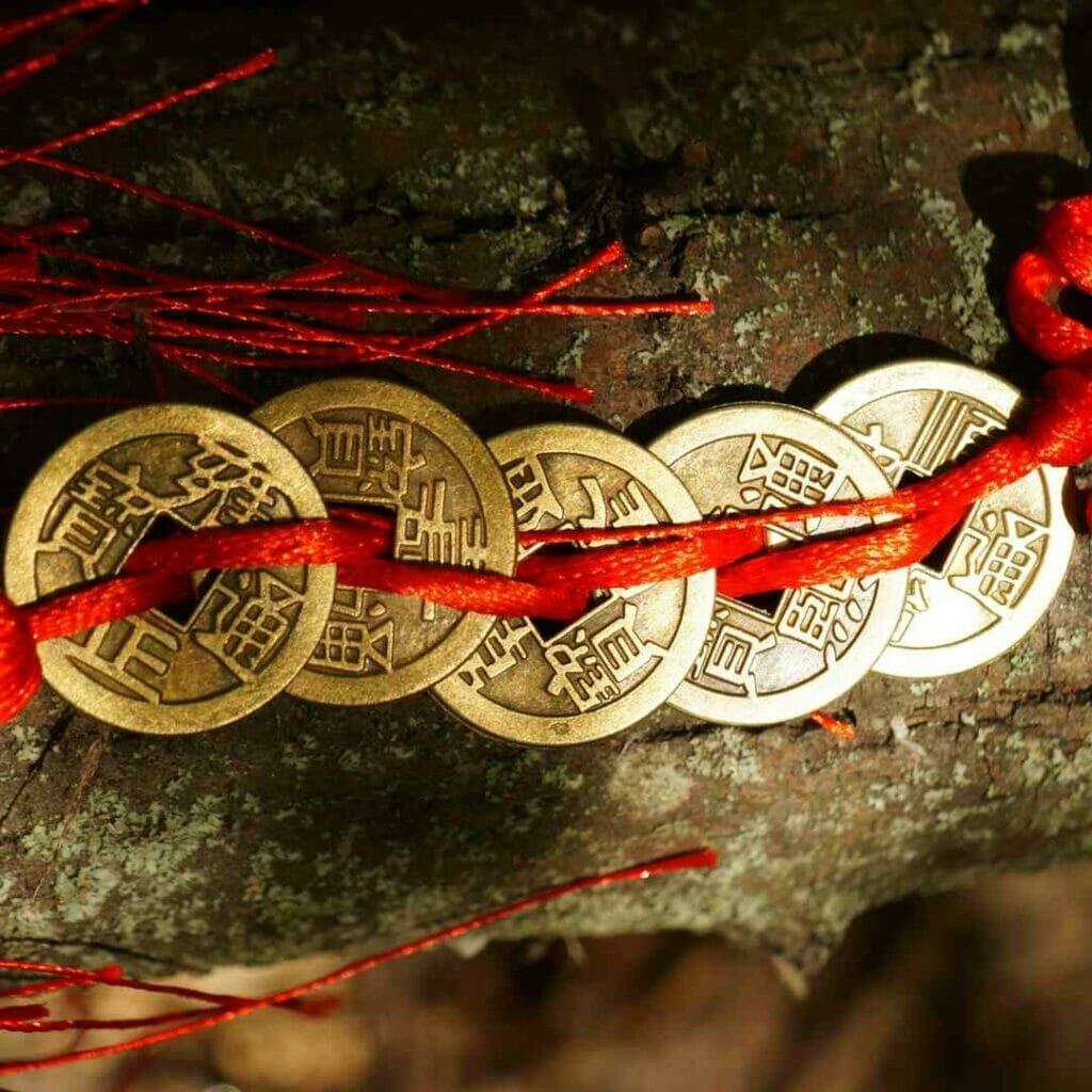 Feng Shui coins tied together with red string.