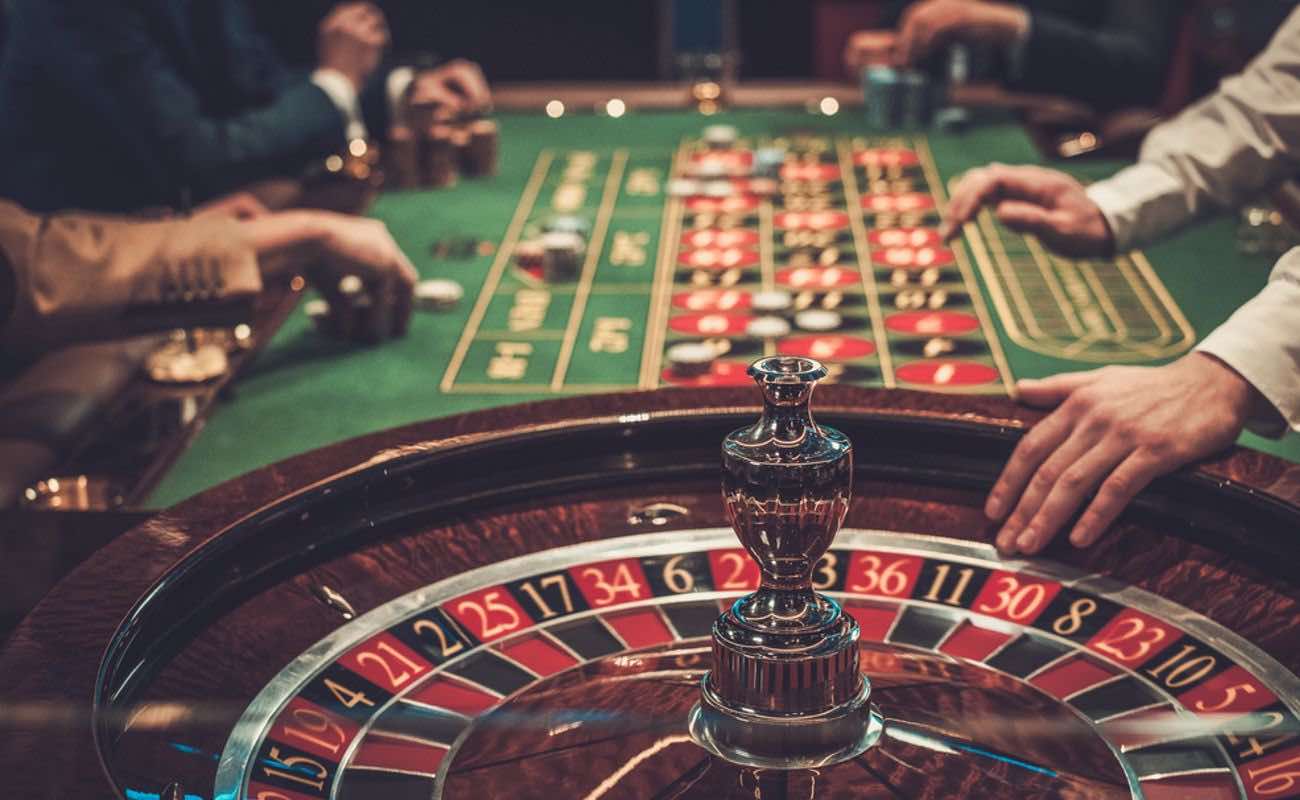 A croupier spins a roulette wheel.