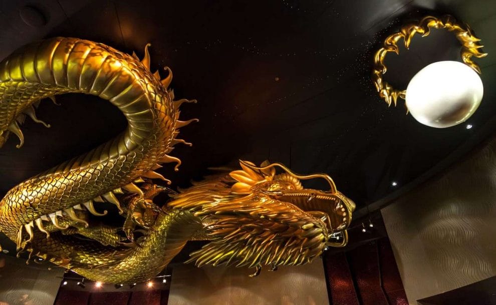 Golden Dragon and Pearl statue on the roof of The City of Dreams Casino in Macau
