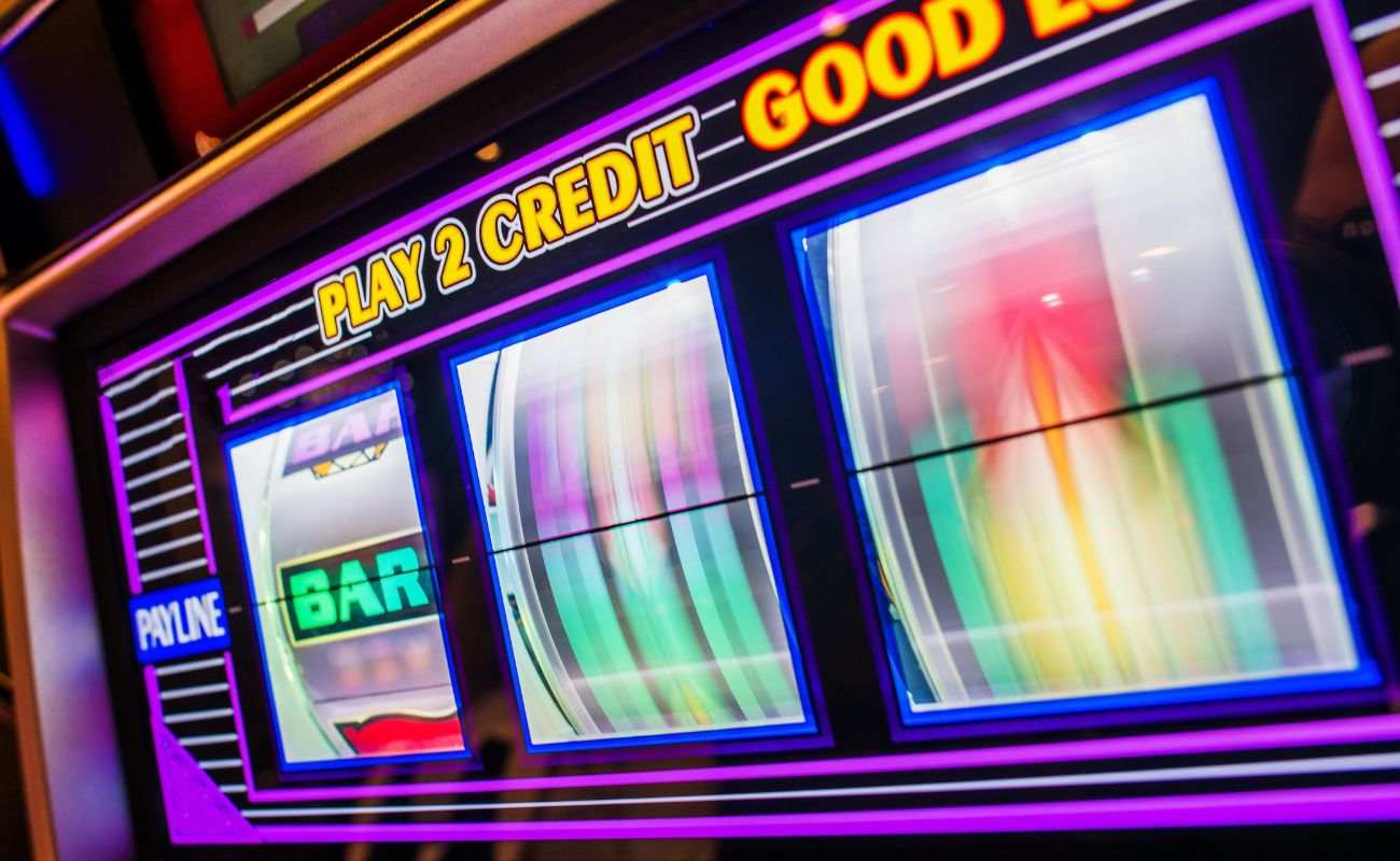 close up of a slot machine spinning in a casino 