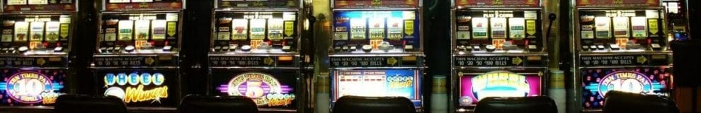 row of slot machines in a casino