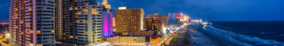 Hero Image - Aerial Shot of Atlantic City Boardwalk at dusk with the ocean on the right