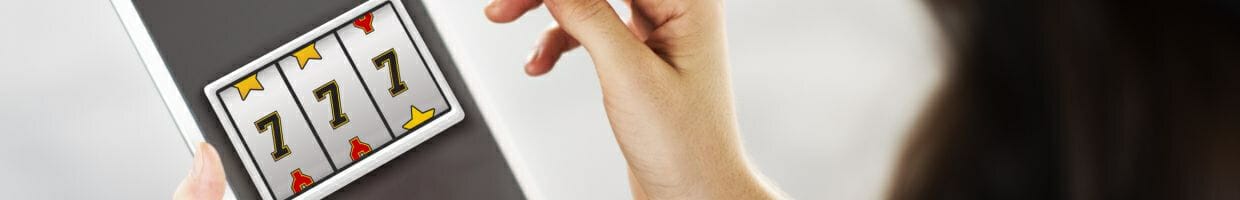 Hero image, woman playing online slots on digital tablet