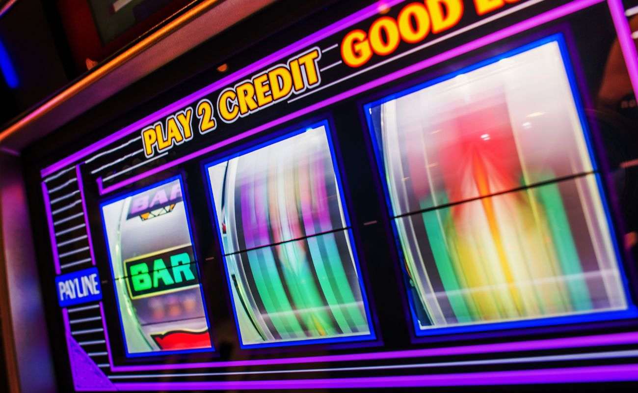 a close up of a lit up slot machine spinning in a casino 