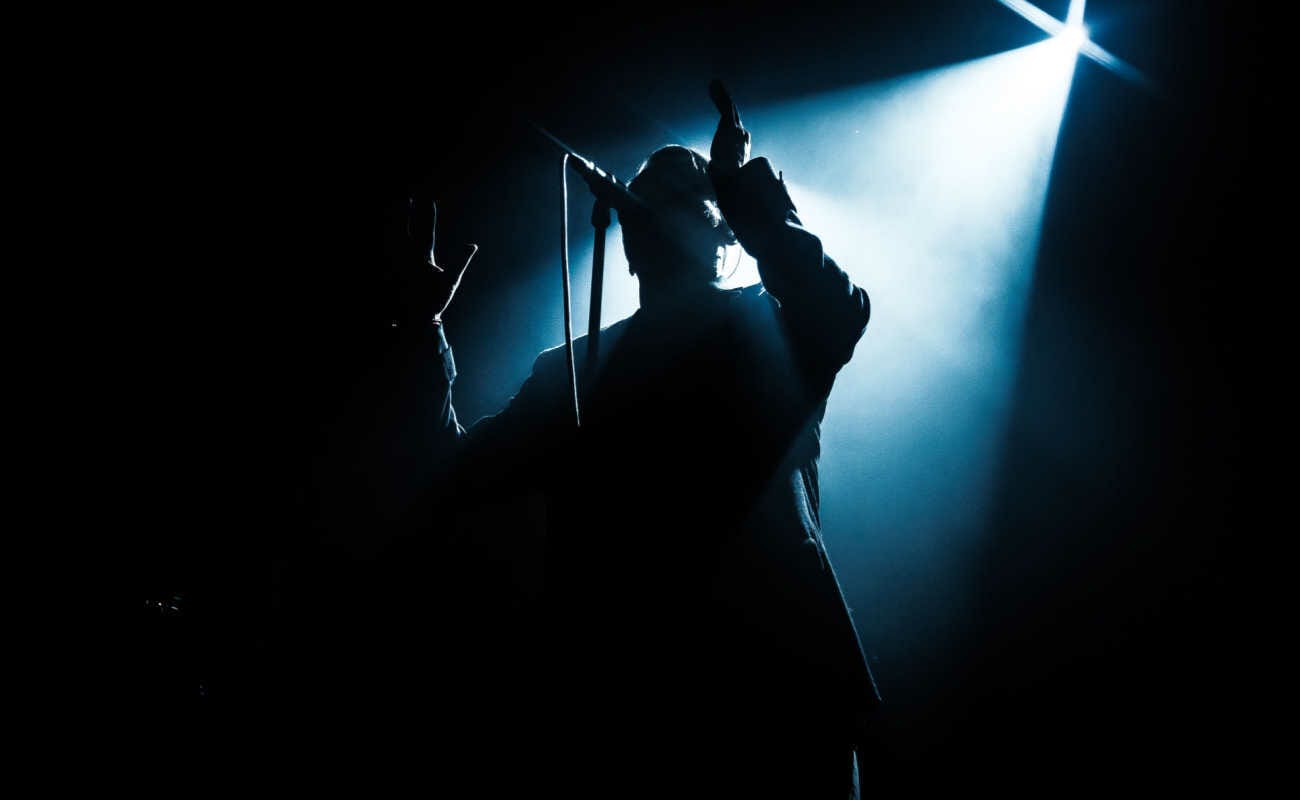 Front view of a singer’s silhouette.