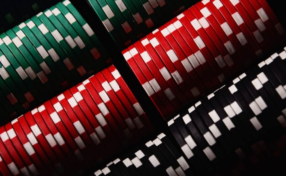 Close up of poker chips stacked according to color