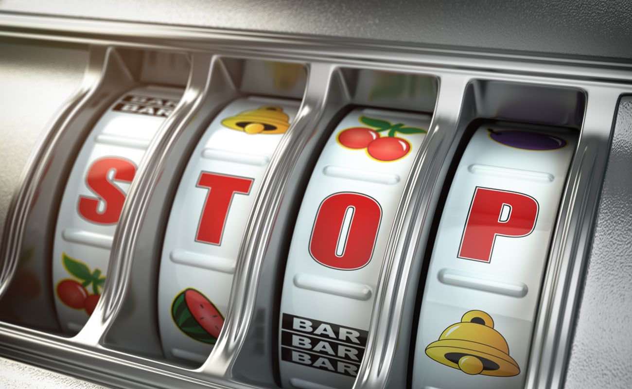 A traditional slot machine featuring the word “STOP” in support of gambling addiction awareness.