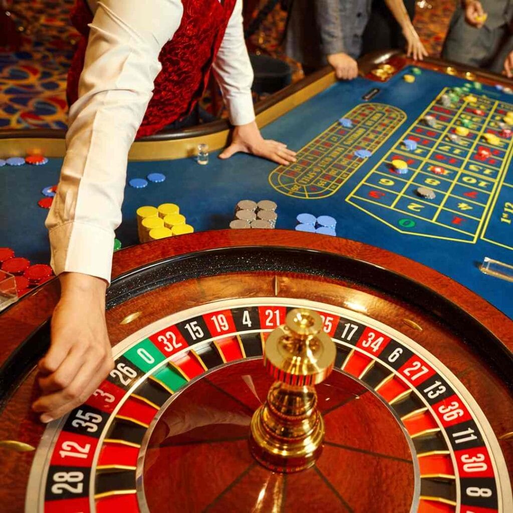 A croupier about to start a game of roulette.