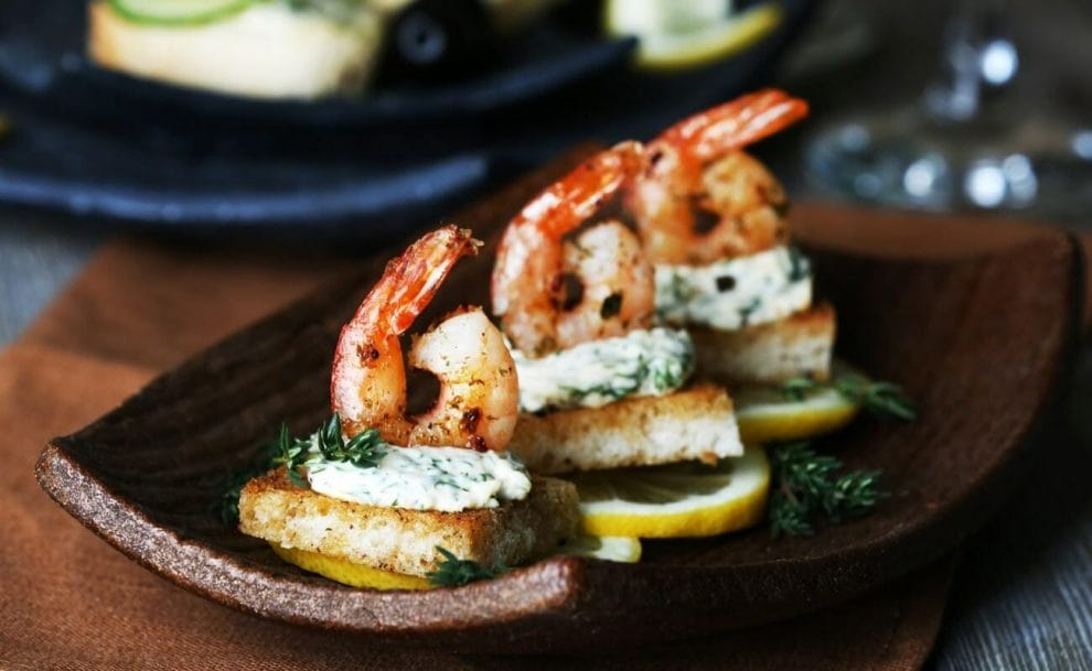 A platter with shrimp appetizers.