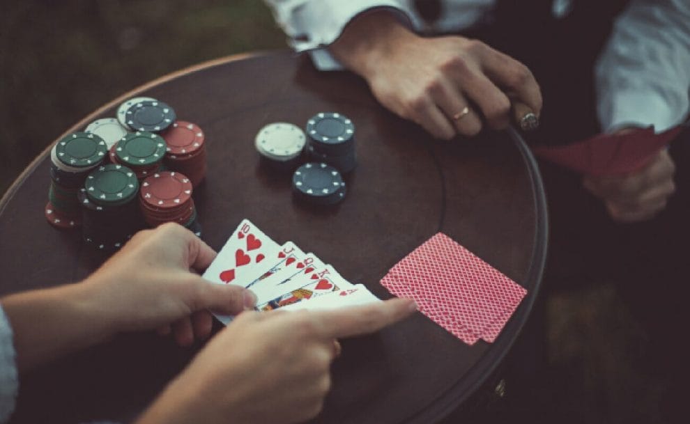 A player puts down a royal flush in a poker game