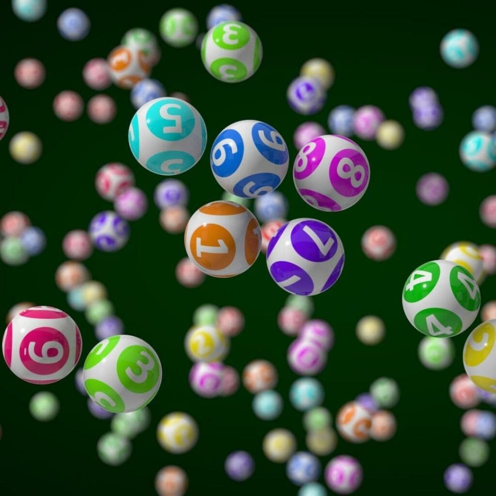Falling bingo balls against a dark green background.